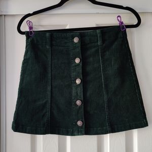 Mini skirt on green forest couroy